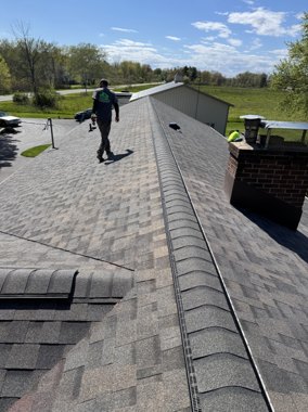 TNE Roofing crew working the edge of a roof