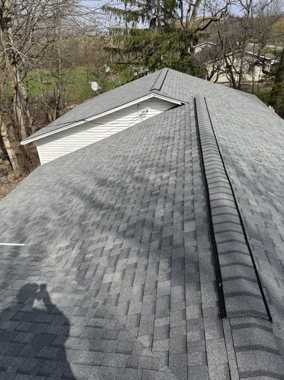 Fresh architectural shingles, blue sky &mdash; TNE Roofing & Siding