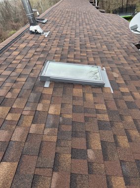 Shingle detail around a roof penetration &mdash; TNE Roofing & Siding